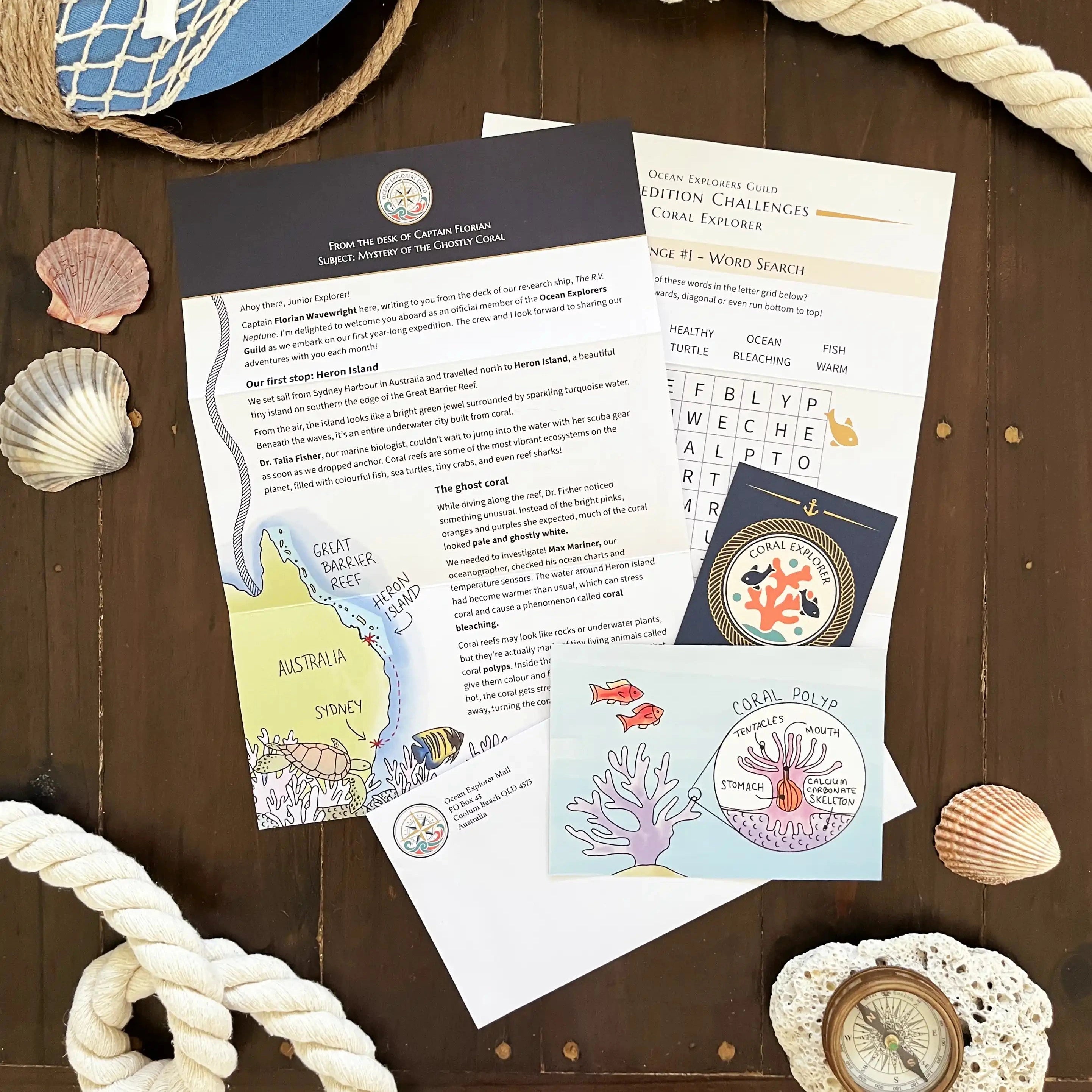 Educational materials on a wooden surface with nautical decorations