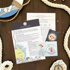 Ocean-themed children's letter pack with seashells and ropes on a wooden surface