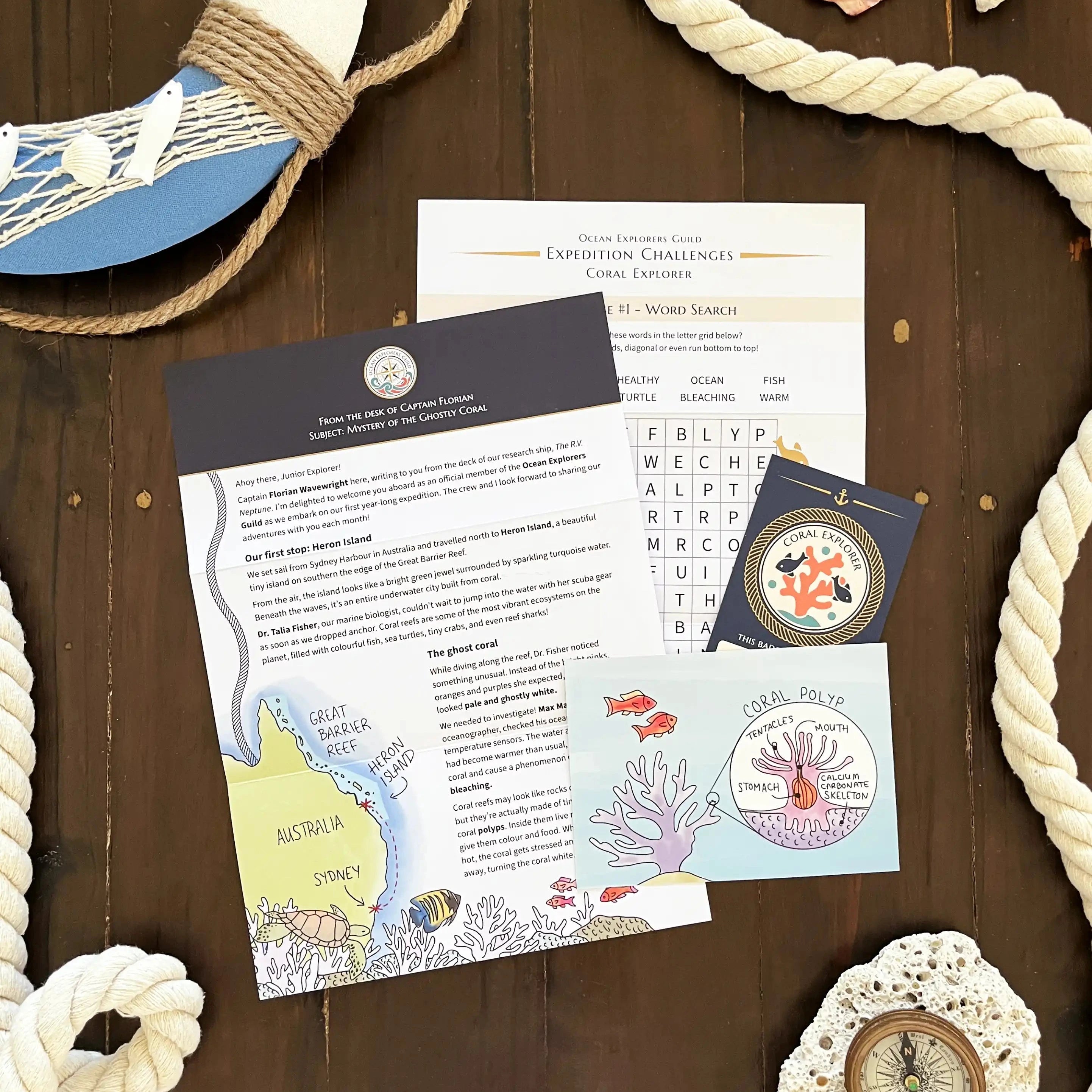 Ocean-themed children's letter pack with seashells and ropes on a wooden surface